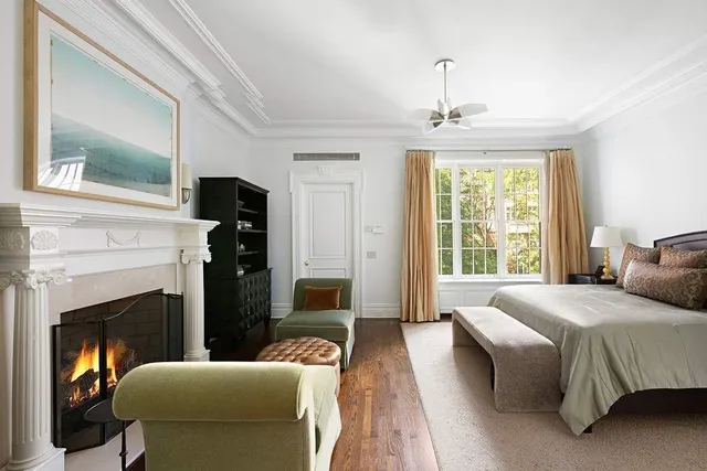 a large white kitchen with cabinets and a stove