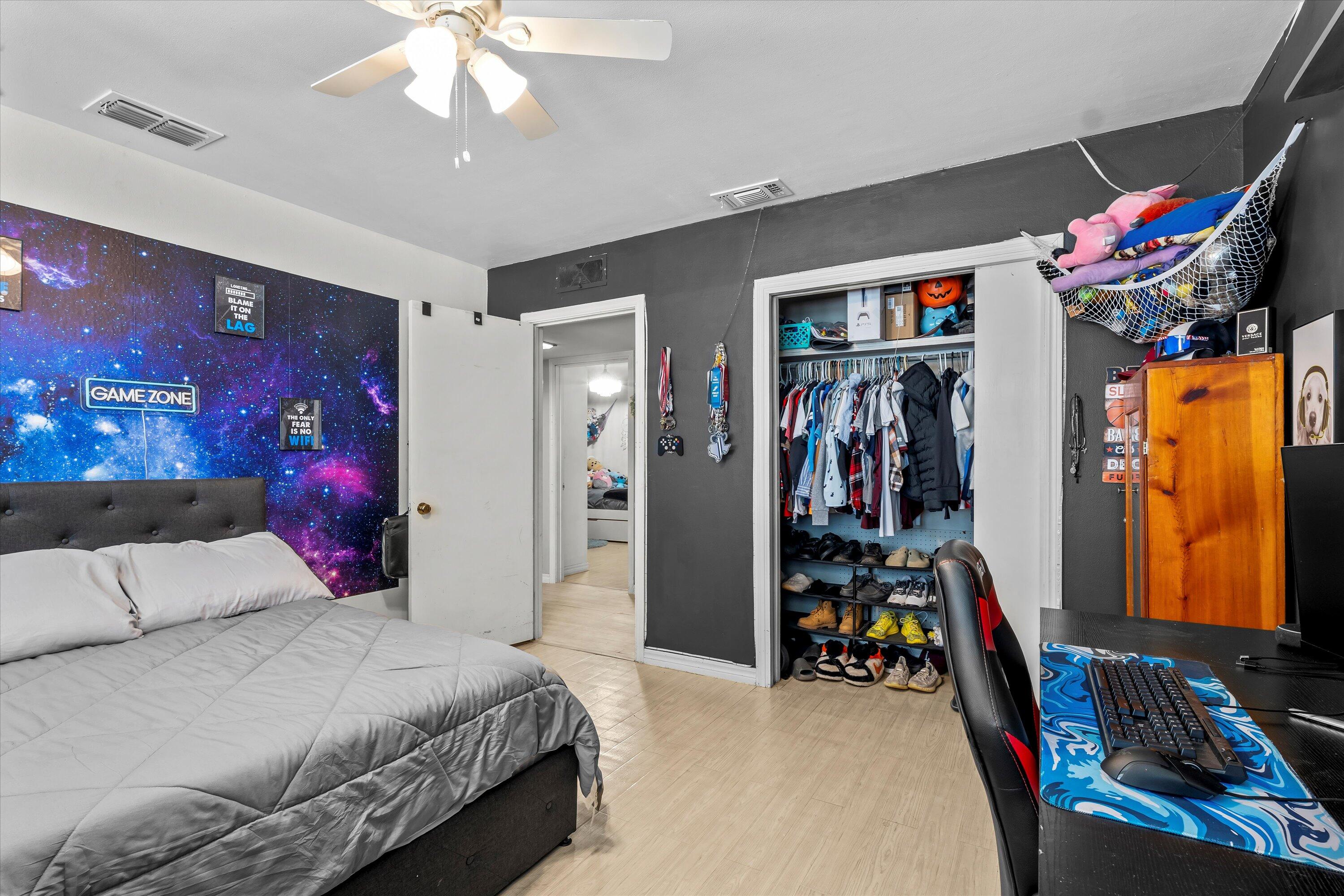 1601 Smith Street Littlefield, TX 79339 - Photo 14 of 32 a bedroom with bed and walk in closet
