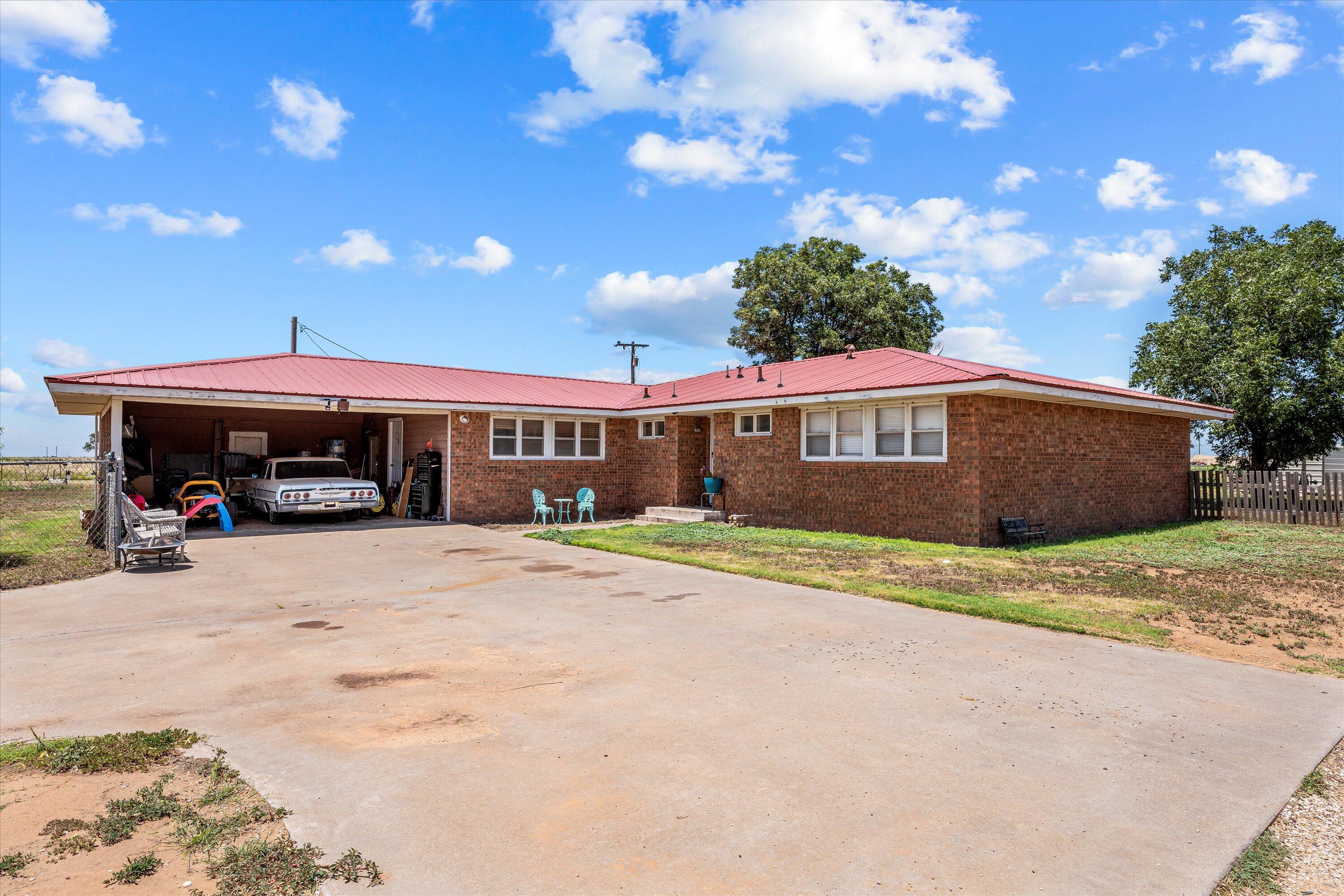 1601 Smith Street Littlefield, TX 79339 - Photo 2 of 32 a house view with a outdoor space