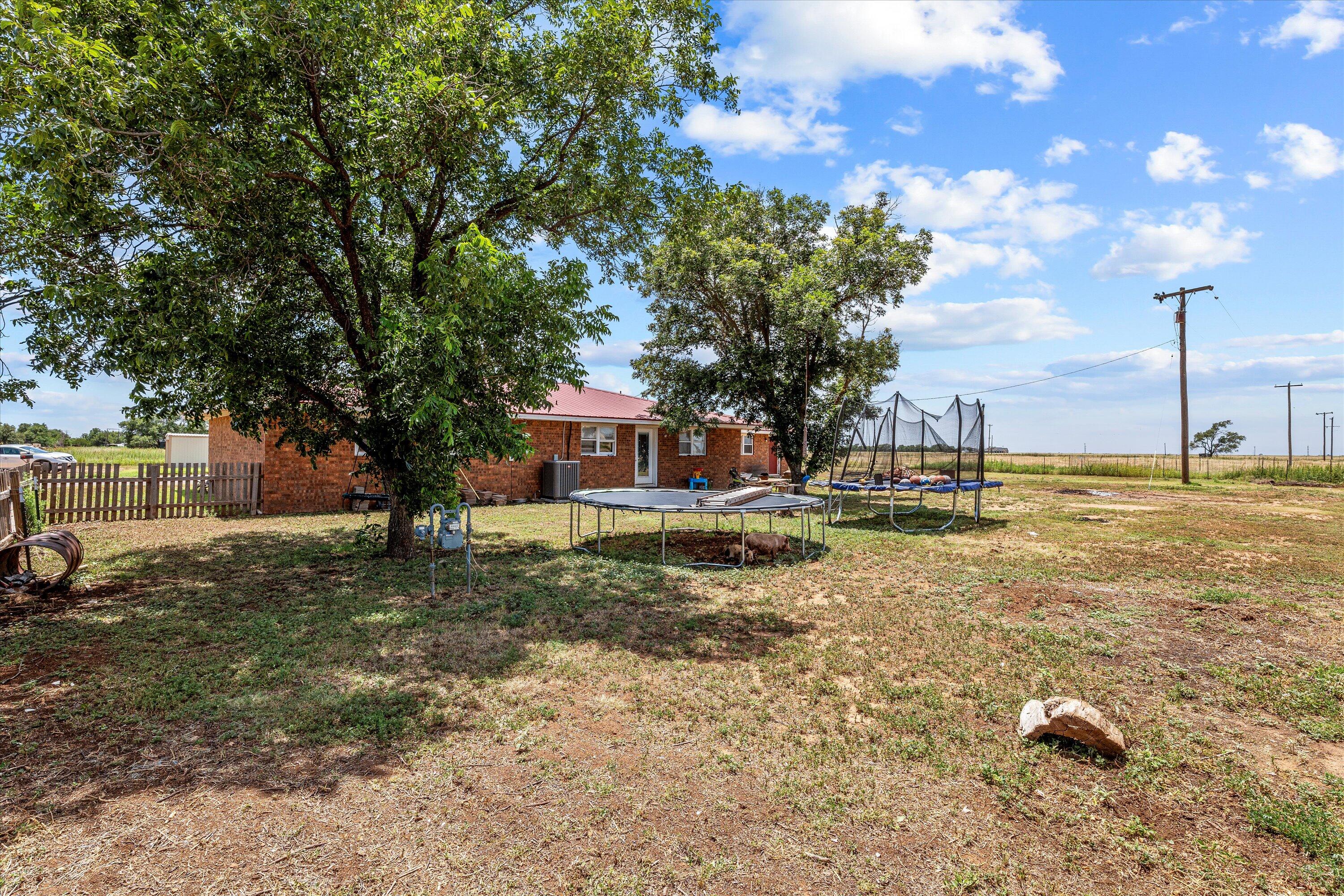 1601 Smith Street Littlefield, TX 79339 - Photo 31 of 32 a view of a house with a yard