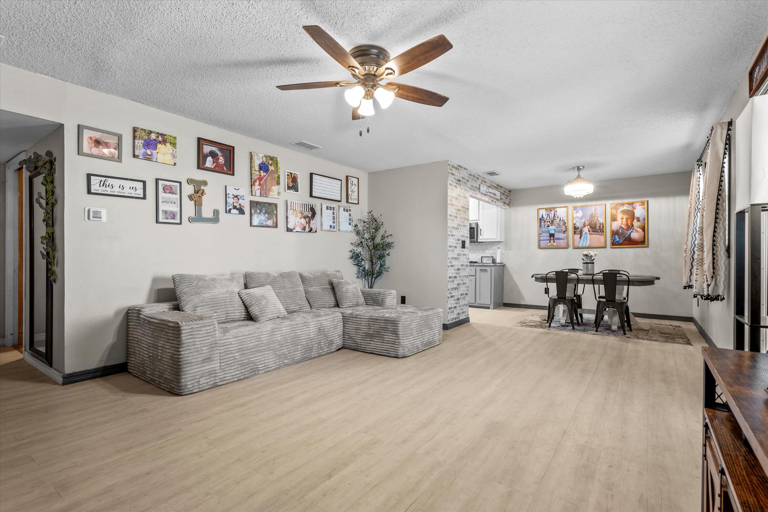 1601 Smith Street Littlefield, TX 79339 - Photo 6 of 32 a living room with furniture and white table