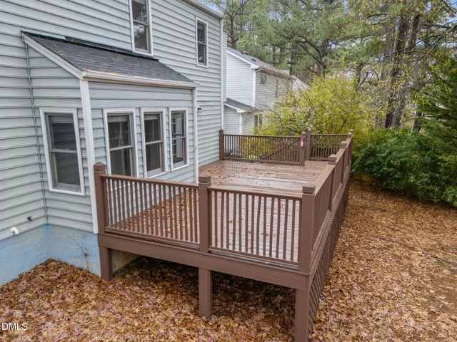 a view of a wooden deck with a bench