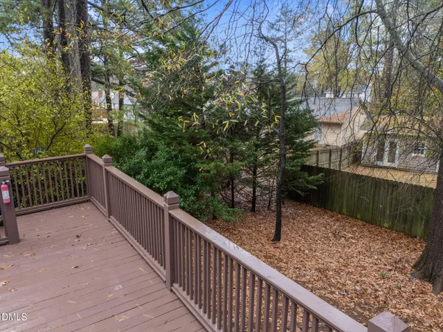 a balcony with trees in front of it