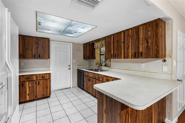a kitchen with stainless steel appliances a stove sink and cabinets