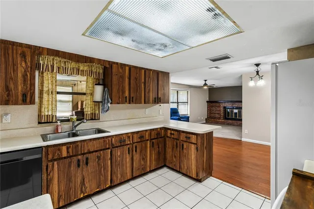 a kitchen with stainless steel appliances granite countertop a sink and cabinets