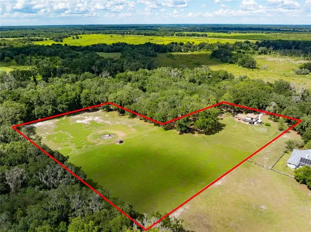 a view of a swimming pool and an outdoor seating
