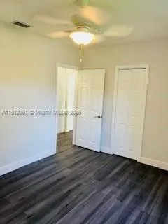 an empty room with wooden floor