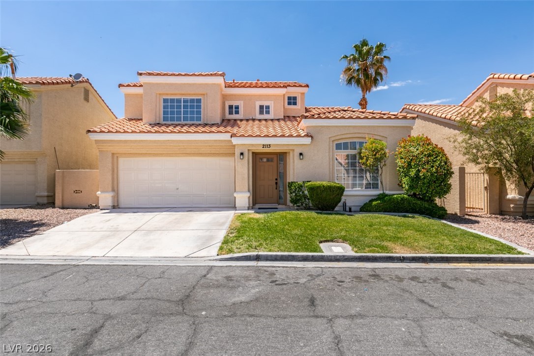 2113 Desert Peak Road Las Vegas, NV 89134 - Photo 1 of 33 This residence features a tiled roof and an attached garage.