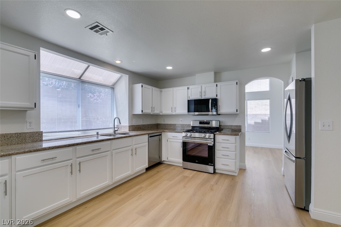 2113 Desert Peak Road Las Vegas, NV 89134 - Photo 15 of 33 This bright kitchen features ample counter space and modern appliances, perfect for any culinary enthusiast.