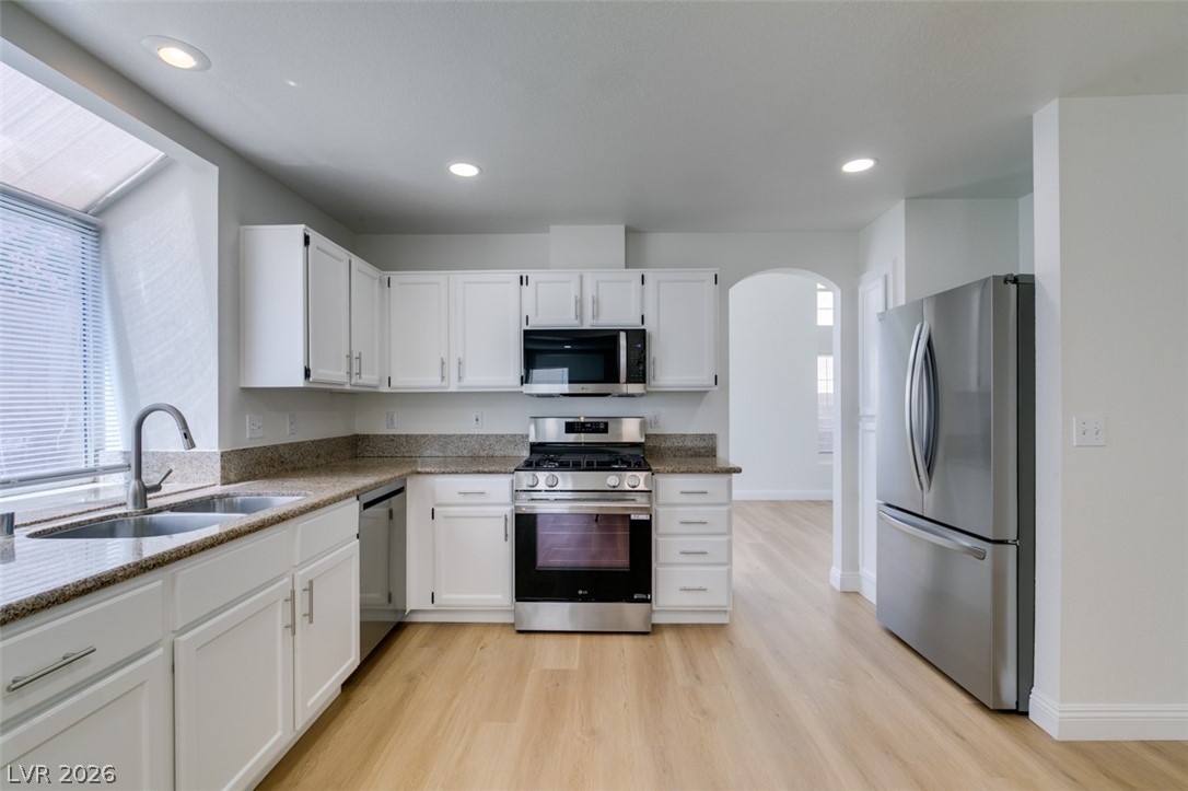 2113 Desert Peak Road Las Vegas, NV 89134 - Photo 16 of 33 This bright kitchen features ample counter space and modern appliances, perfect for everyday living.