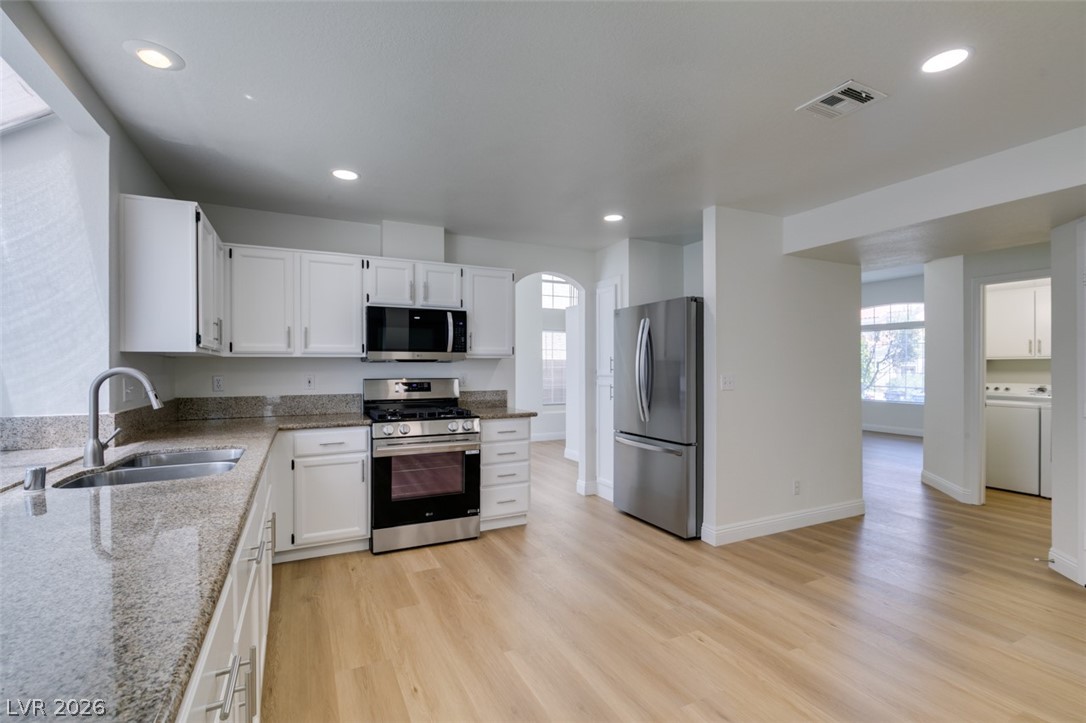 2113 Desert Peak Road Las Vegas, NV 89134 - Photo 17 of 33 This bright kitchen features sleek appliances, ample counter space, and durable flooring.