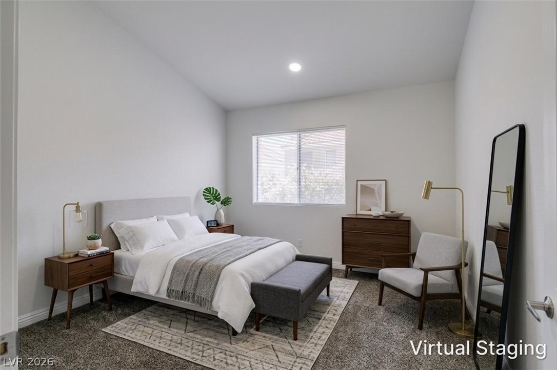 2113 Desert Peak Road Las Vegas, NV 89134 - Photo 23 of 33 Bright and airy, this bedroom features a vaulted ceiling and a large window, creating a serene retreat.