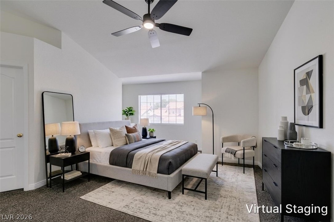 2113 Desert Peak Road Las Vegas, NV 89134 - Photo 26 of 33 This spacious bedroom offers a serene retreat with vaulted ceilings and ample natural light.