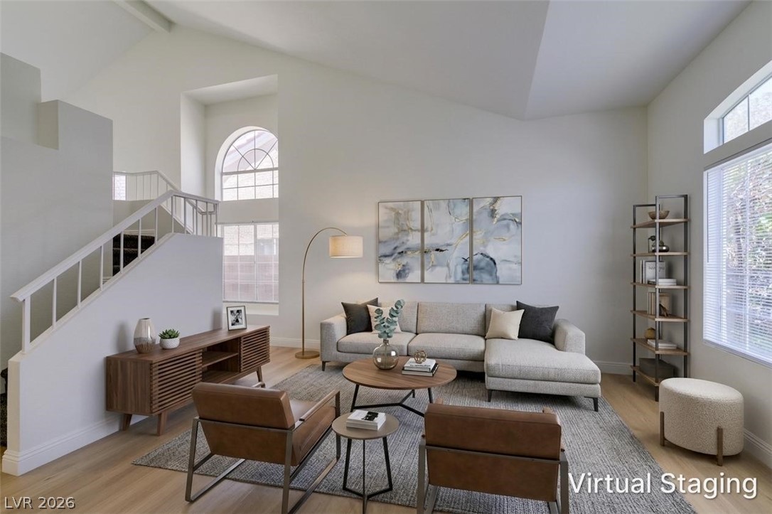 2113 Desert Peak Road Las Vegas, NV 89134 - Photo 3 of 33 This airy living room features high ceilings, creating a spacious and open atmosphere.