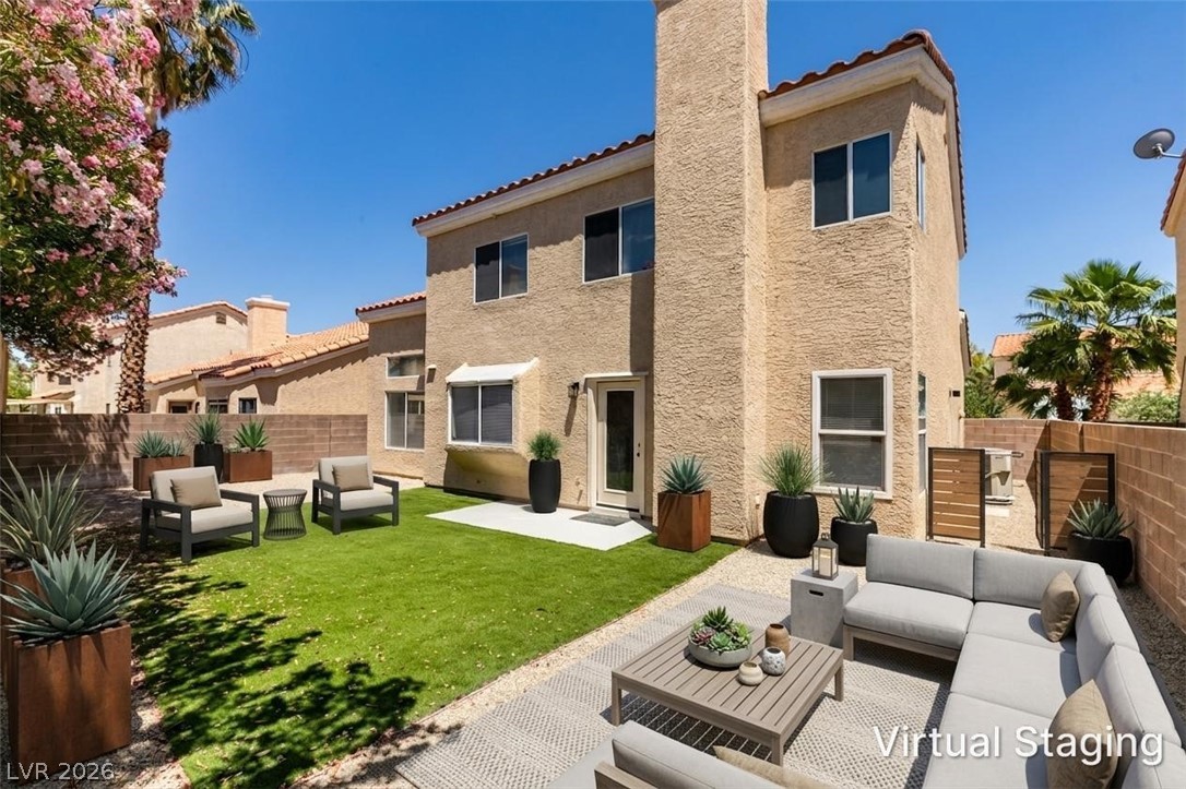 2113 Desert Peak Road Las Vegas, NV 89134 - Photo 32 of 33 This private yard offers a perfect blend of outdoor living and relaxation.