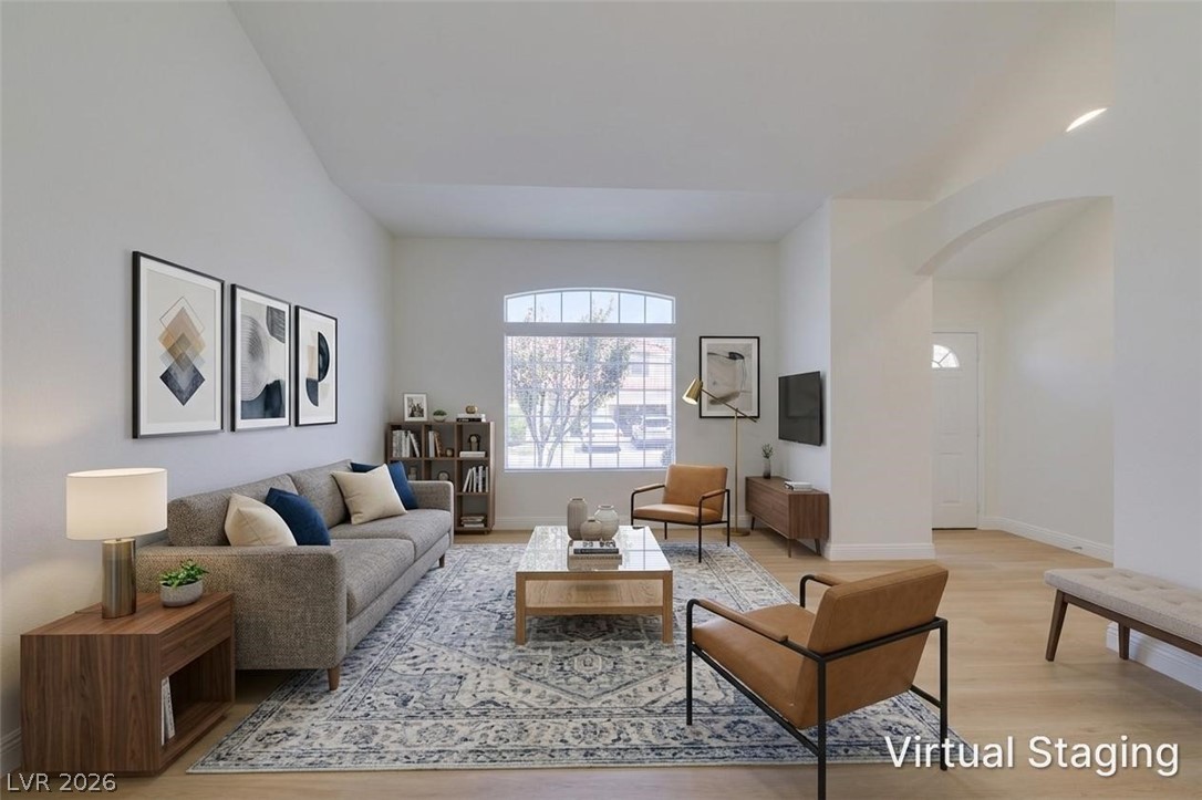 2113 Desert Peak Road Las Vegas, NV 89134 - Photo 4 of 33 This bright living space features tall ceilings and elegant flooring, perfect for comfortable living.