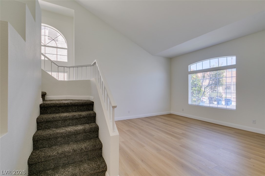 2113 Desert Peak Road Las Vegas, NV 89134 - Photo 5 of 33 This bright space features an elegant staircase and expansive windows.