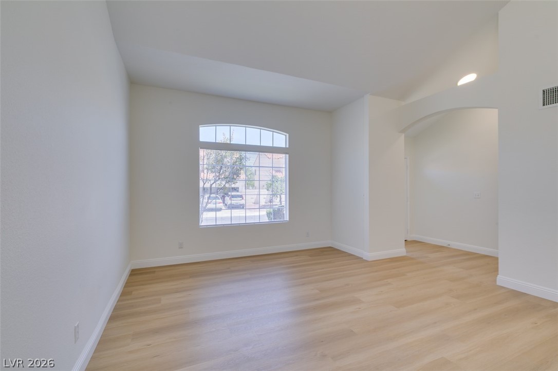 2113 Desert Peak Road Las Vegas, NV 89134 - Photo 6 of 33 This bright living space features elegant hardwood flooring and ample natural light.
