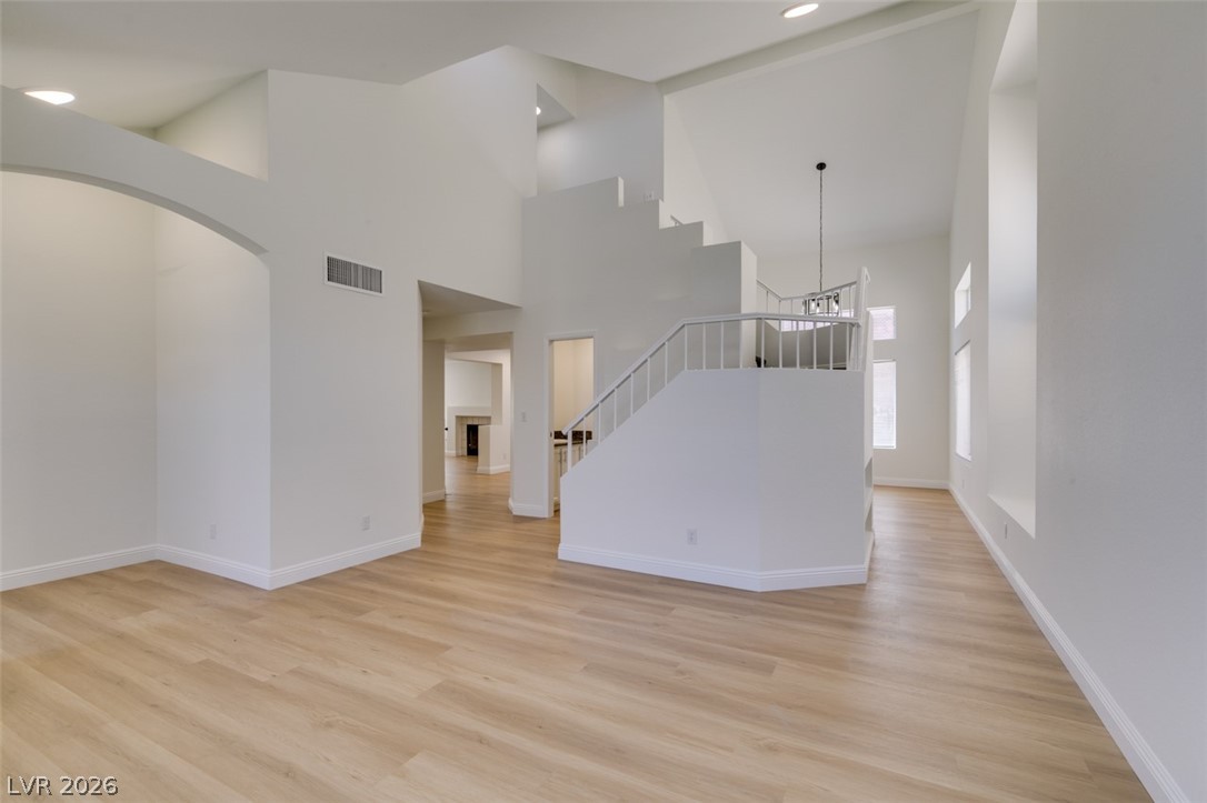 2113 Desert Peak Road Las Vegas, NV 89134 - Photo 9 of 33 This airy space features high ceilings and a grand staircase.