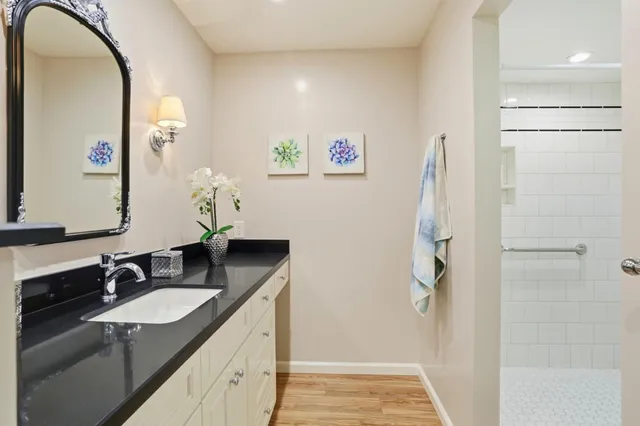 a bedroom with a bed and a large mirror