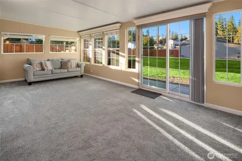 a living room with furniture and windows
