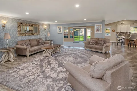 a living room with furniture and a table