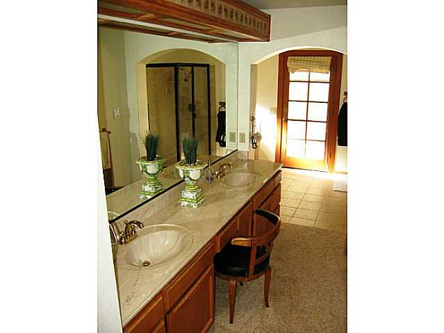 2832 Live Oak Park Road Fallbrook, CA 92028 - Photo 19 of 25 Double sinks, large tub, shower, water closet, exit door to walkway.