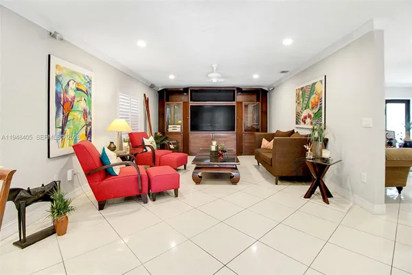a living room with furniture and a flat screen tv