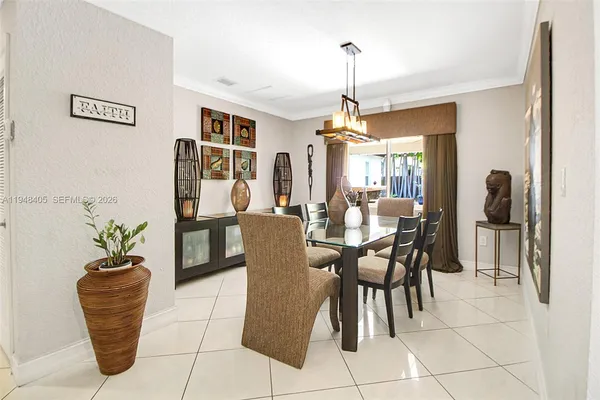 a dining room with furniture and window
