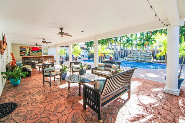 a view of a chairs and table in the patio
