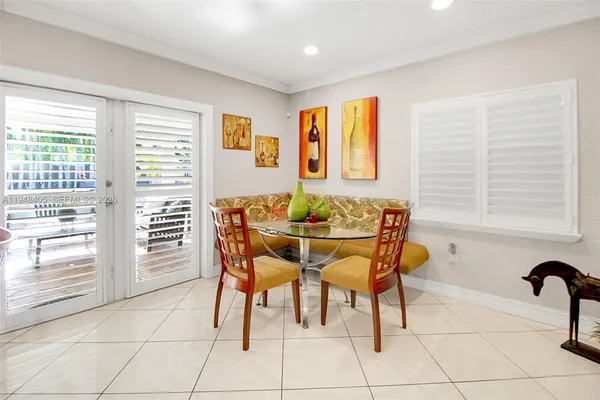 a dining room with furniture and window
