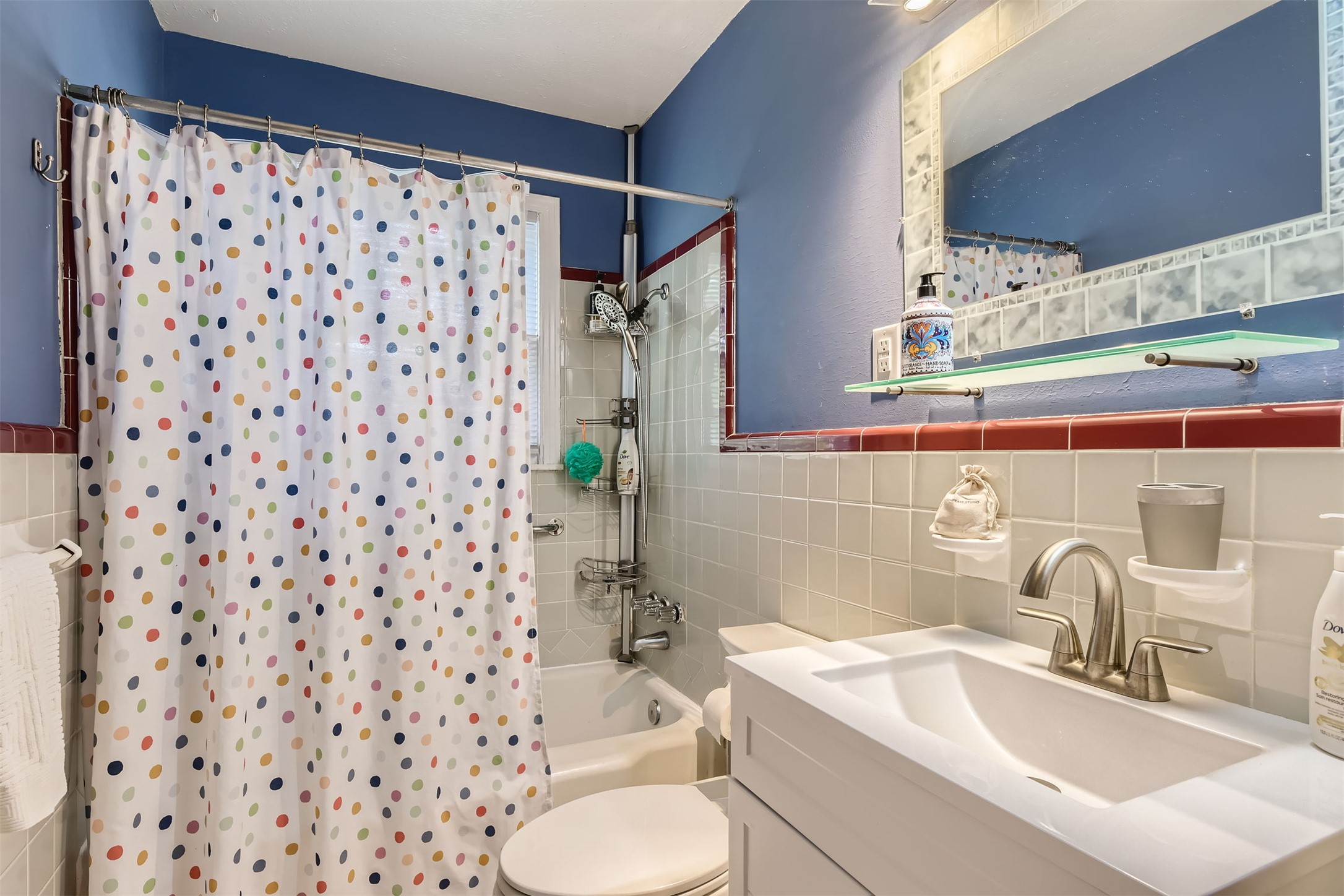 6804 Vine Street Austin, TX 78757 - Photo 9 of 15 a bathroom with a sink toilet and shower