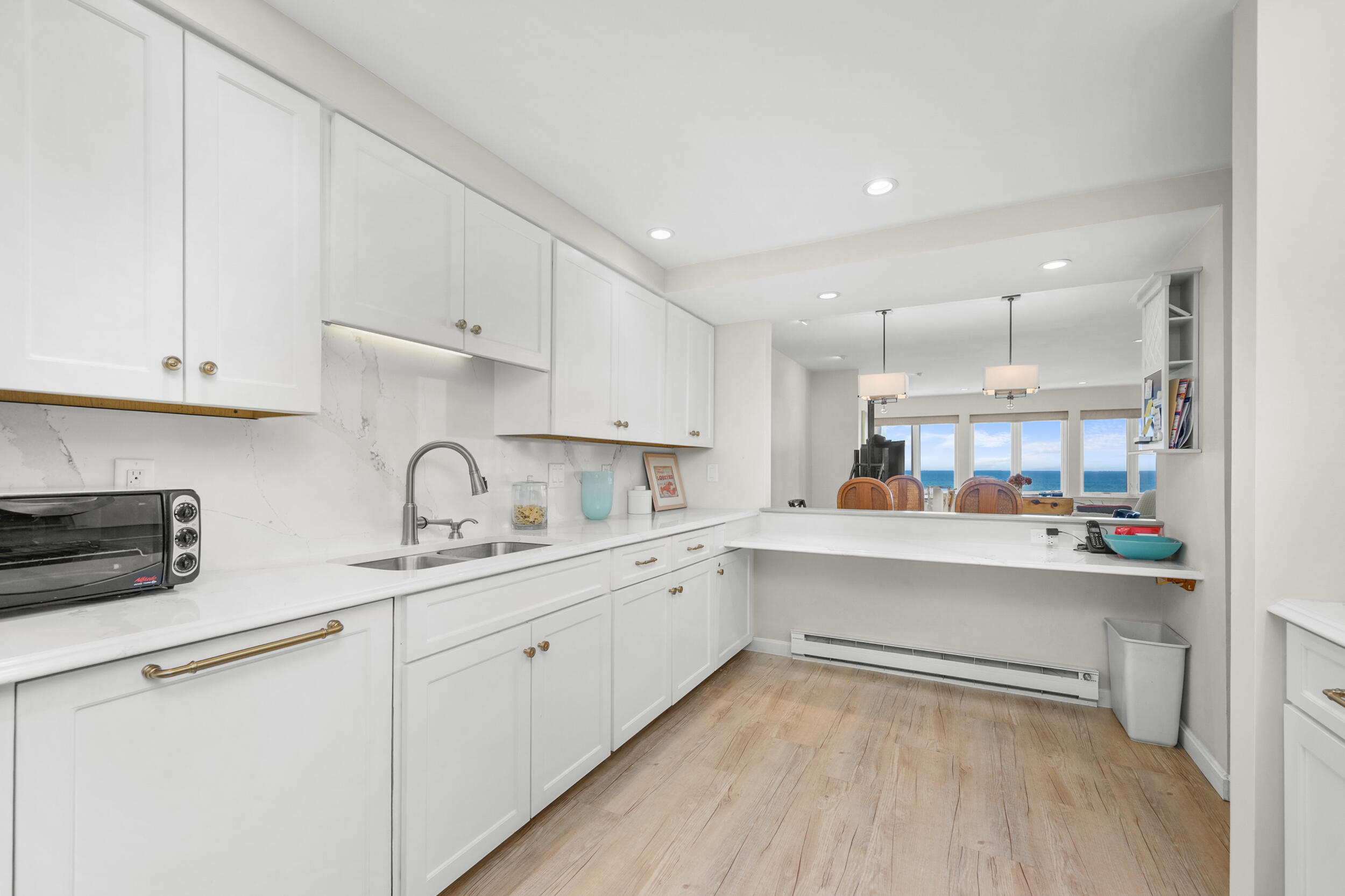 1 Belmont Road, Unit 341 West Harwich, MA 02671 - Photo 12 of 30 a kitchen with a sink cabinets and wooden floor