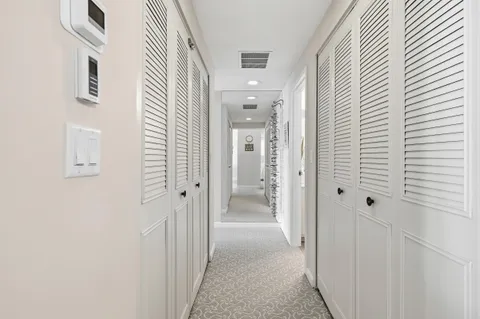 a view of a hallway with a white walls