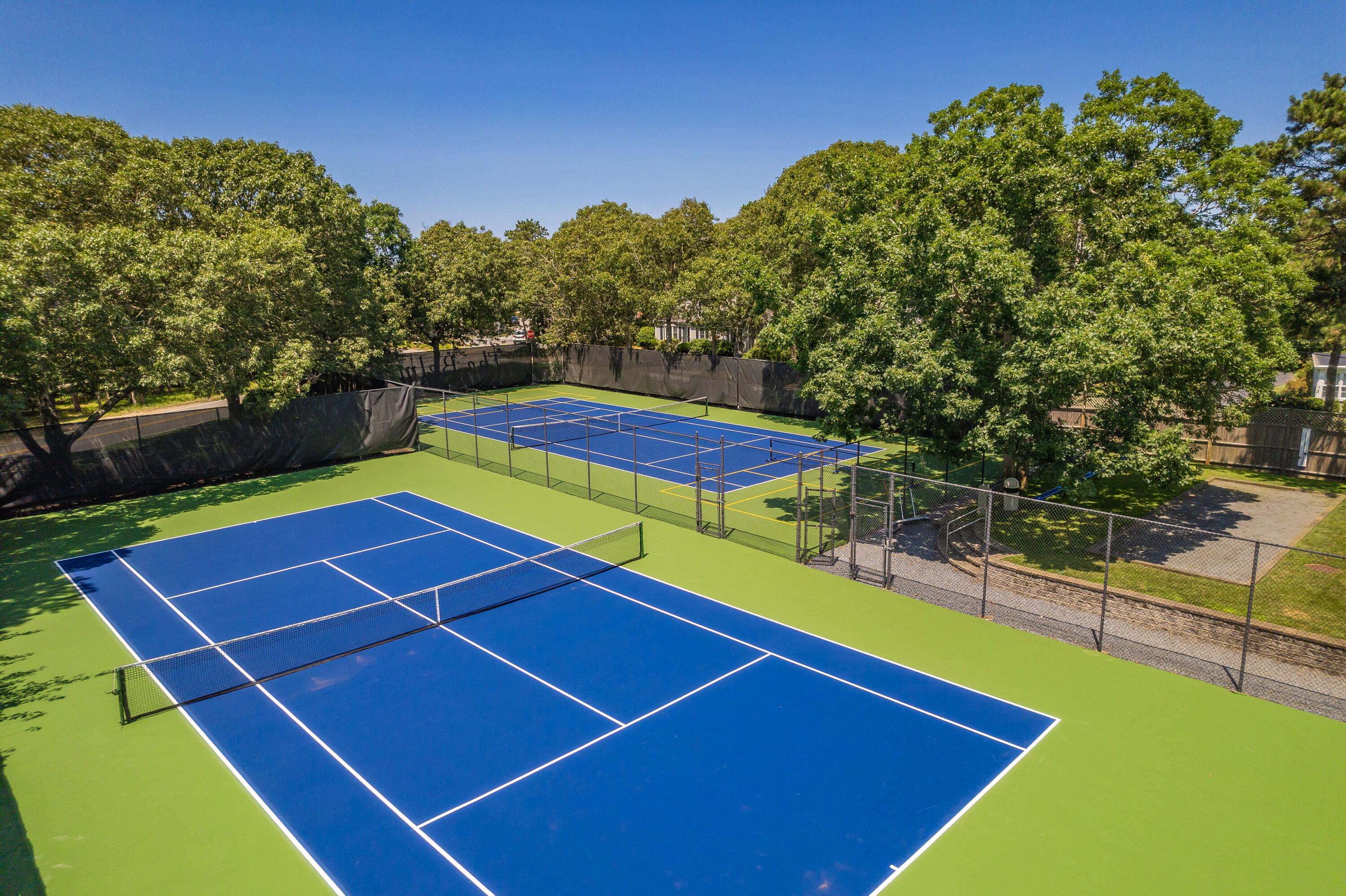 1 Belmont Road, Unit 341 West Harwich, MA 02671 - Photo 27 of 30 a view of a tennis court with a large pool