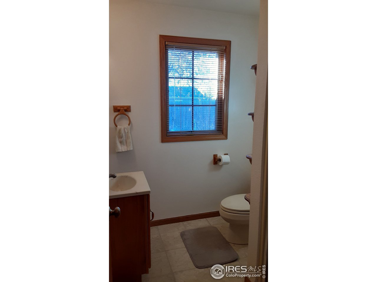1401 Adams Circle Sterling, CO 80751 - Photo 14 of 16 a bathroom with a toilet and a potted plant