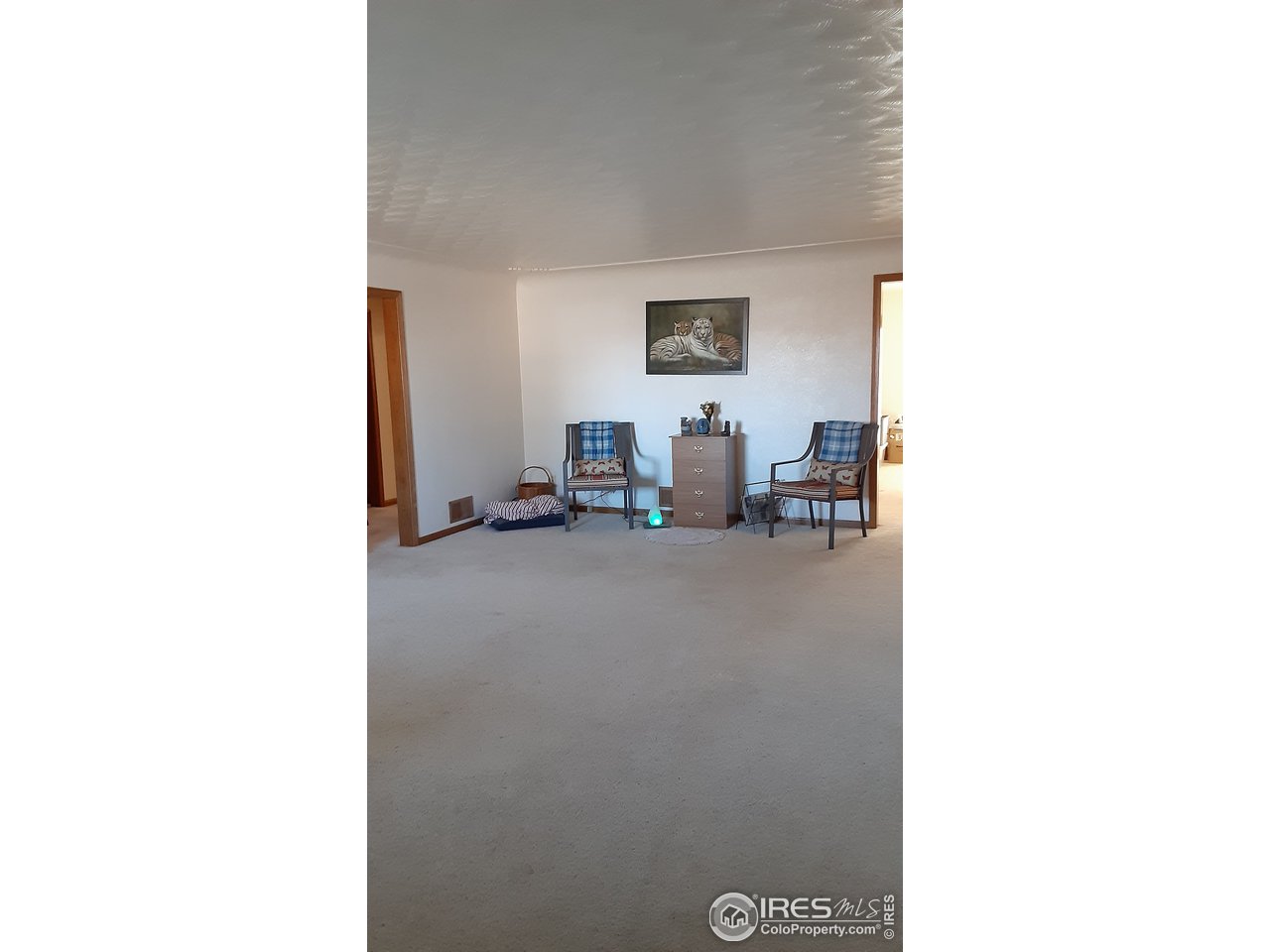 1401 Adams Circle Sterling, CO 80751 - Photo 7 of 16 a view of a room with a table and a chair