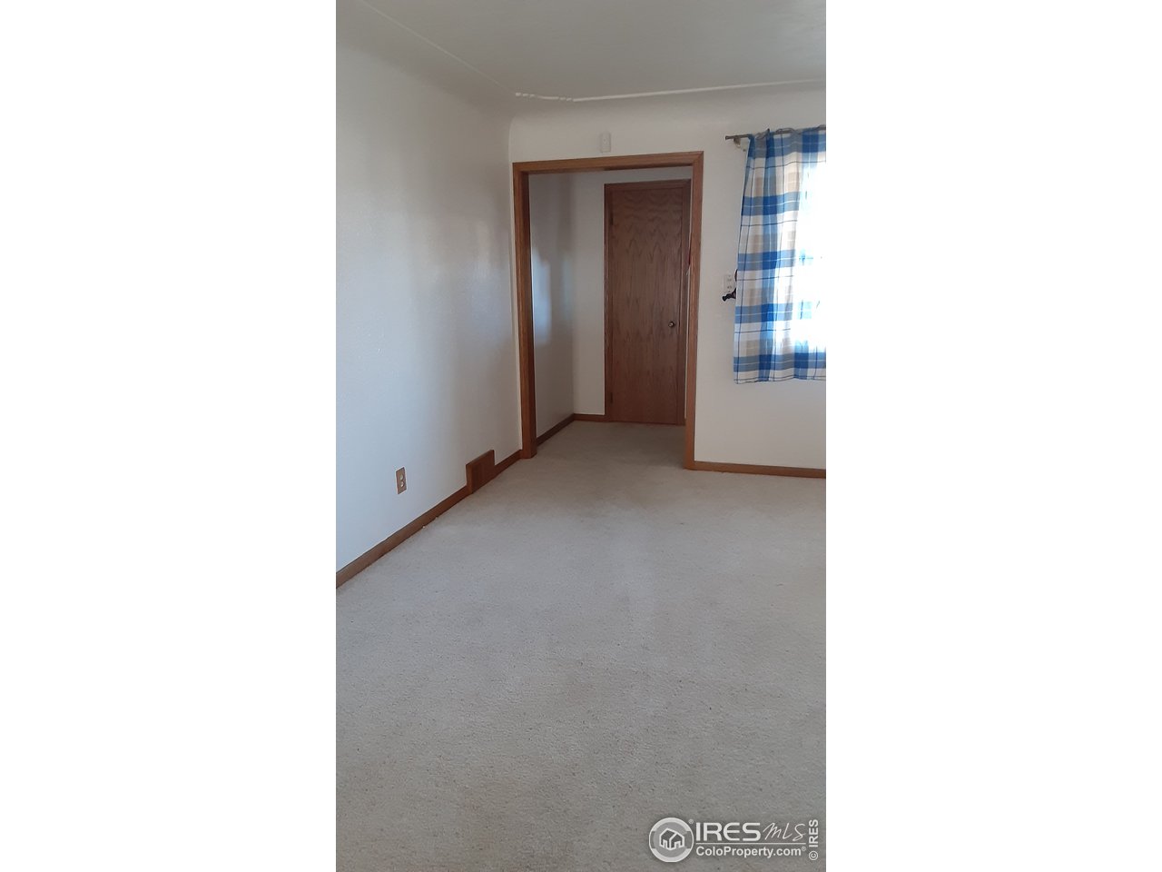 1401 Adams Circle Sterling, CO 80751 - Photo 8 of 16 a view of a room with windows