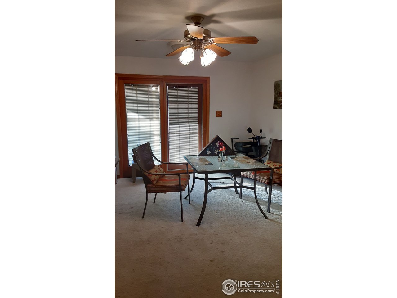 1401 Adams Circle Sterling, CO 80751 - Photo 9 of 16 a living room with furniture and a chandelier