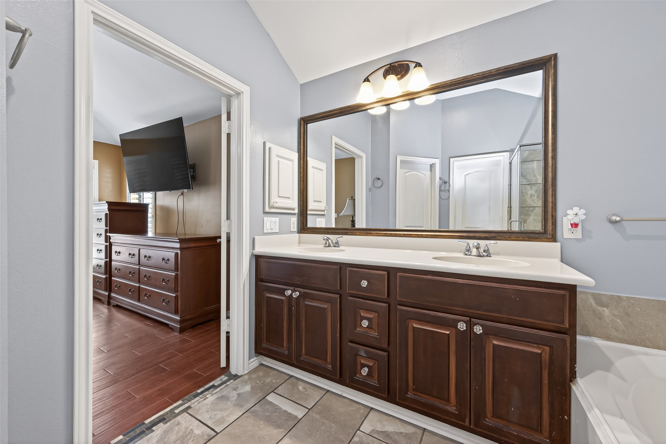 27443 Rebecca Field Lane Spring, TX 77386 - Photo 17 of 31 This photo showcases a modern bathroom with a double sink vanity