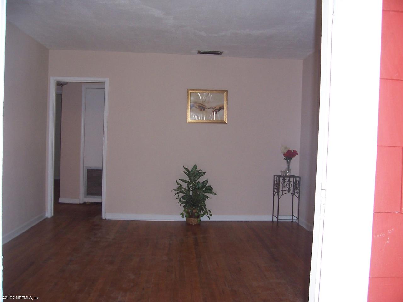 4908 Dundee Road Jacksonville, FL 32210 - Photo 2 of 16 a view of a hallway with closet