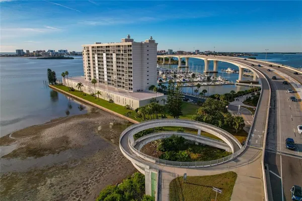 a view of a lake with chairs