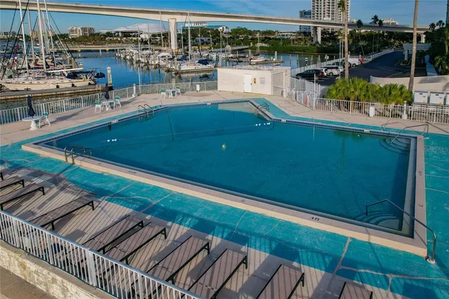 a dining room with furniture a window and wooden floor