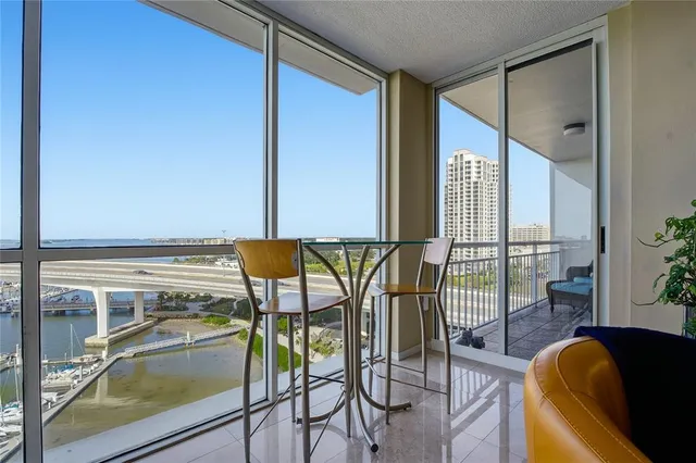 a view of roof deck with outdoor seating and city view