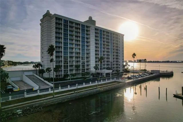 a view of a dining room with furniture a chandelier and wooden floor