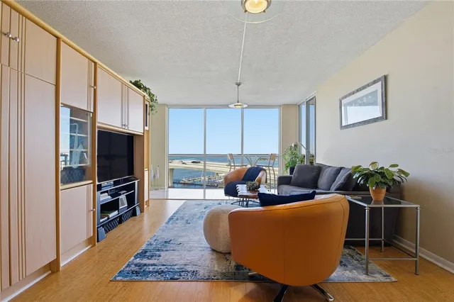 a kitchen with stainless steel appliances a stove a sink and a microwave