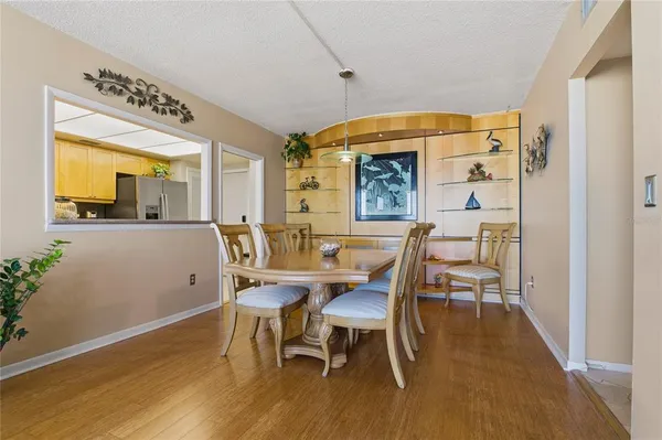 a bedroom with a bed and large windows