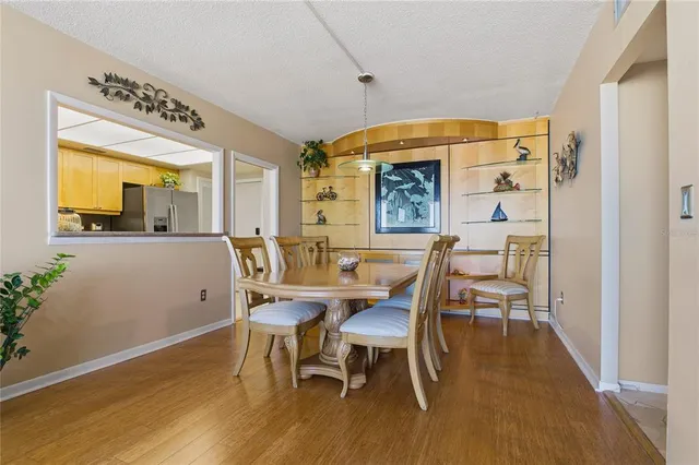 a bedroom with a bed and large windows