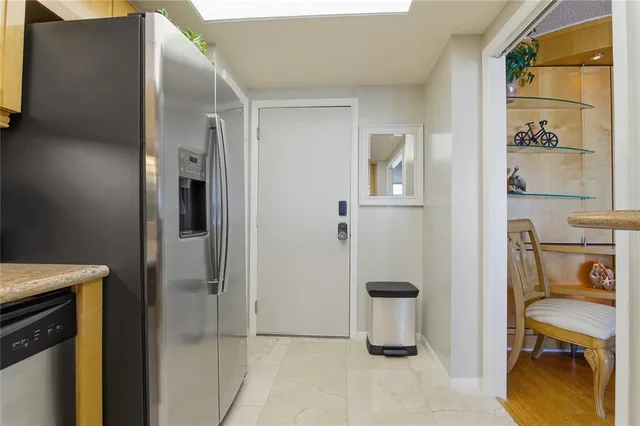 a bedroom with a bed and a potted plant