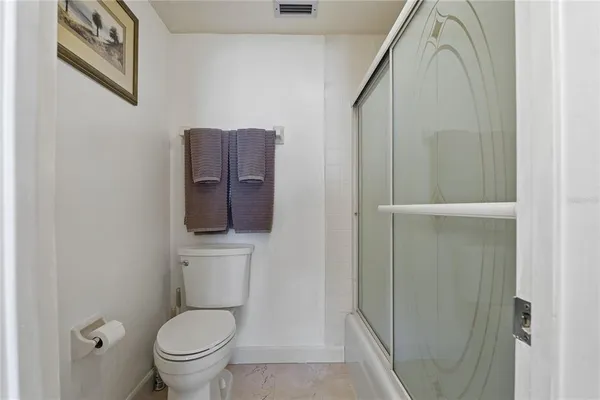 a living room with furniture rug and a window